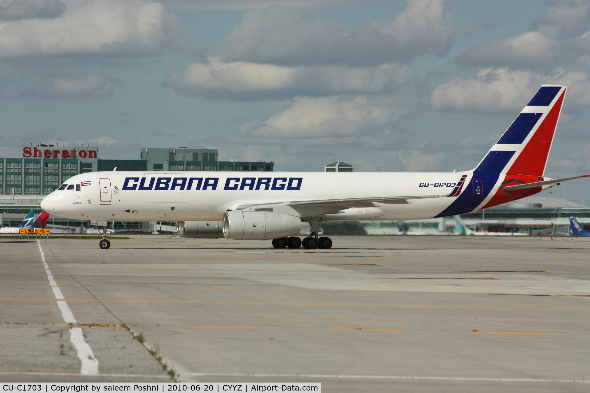 CU-C1703, 2008 Tupolev Tu-204CE C/N 145074-64037, Cubana Cargo taxing to cargo terminal beside U.S.A.F C17