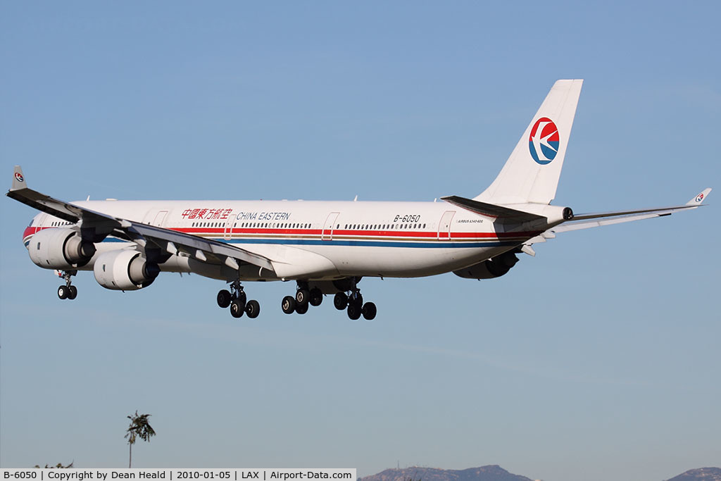 B-6050, 2002 Airbus A340-642 C/N 468, China Eastern B-6050 seconds from landing on RWY 24R.