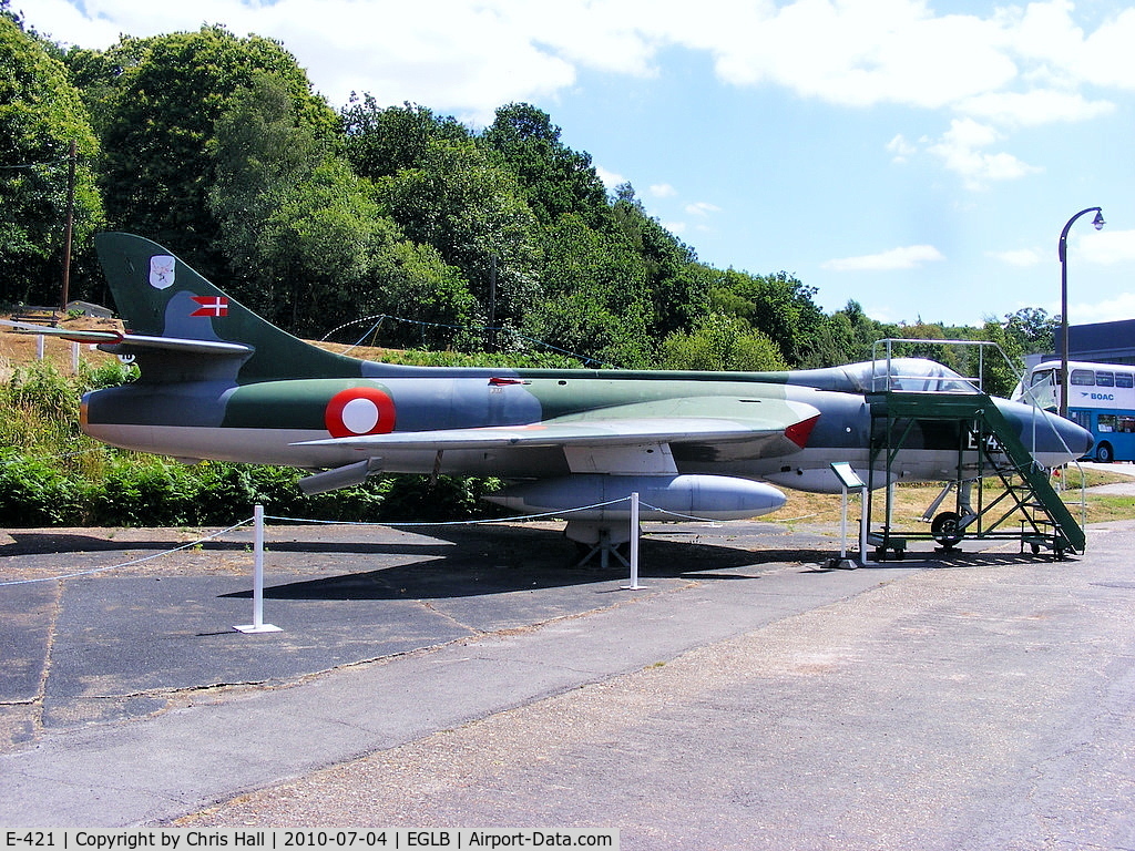E-421, Hawker Hunter F.51 C/N 41H/680280, Hunter E-421 painted in the earlier RDAF colour scheme and fitted with a pair of 100 gal. Harrier drop tanks