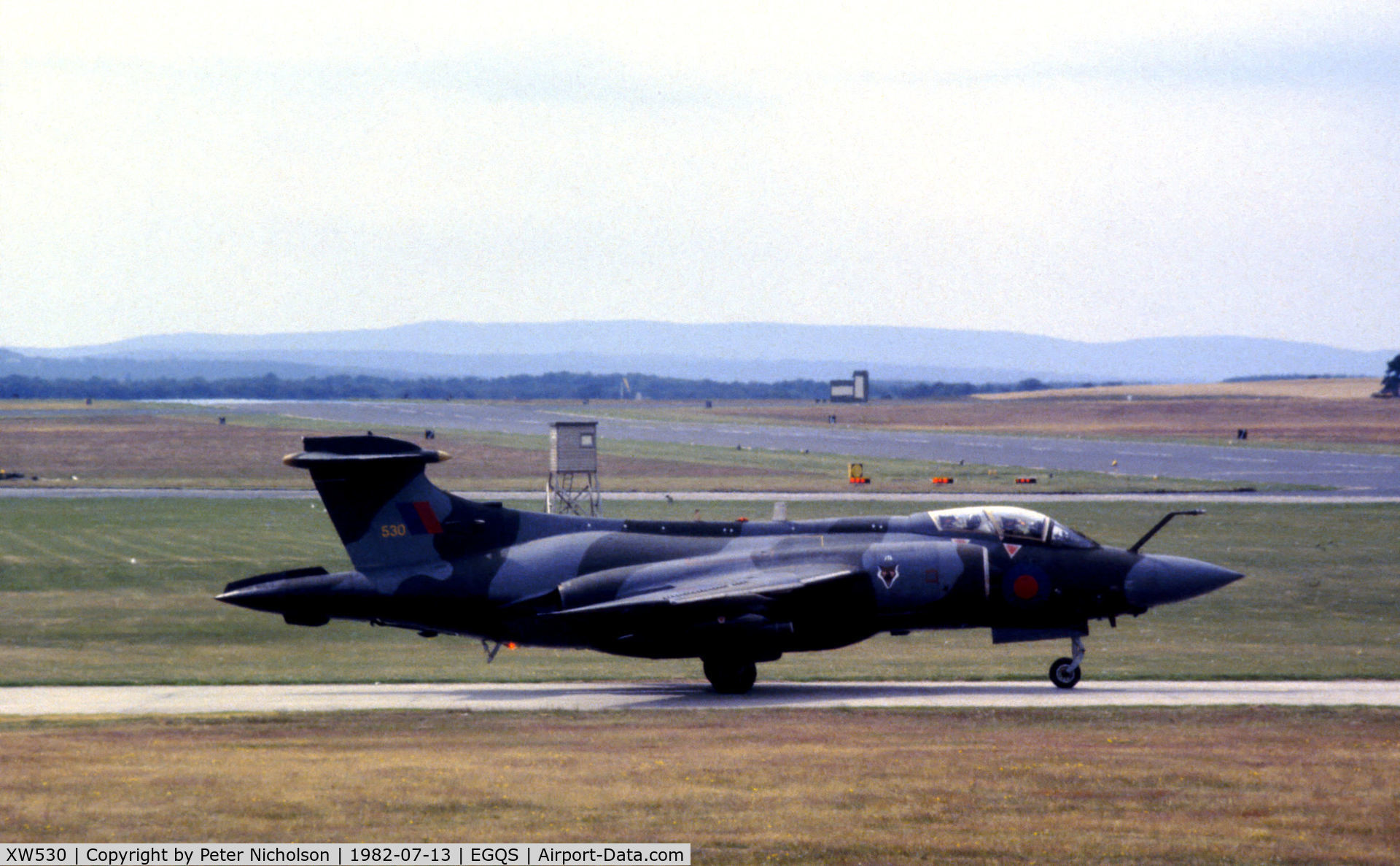 XW530, 1970 Hawker Siddeley Buccaneer S.2B C/N B3-06-69, Buccaneer S.2B of 12 Squadron awaiting clearance to join the active runway at RAF Lossiemouth in the Summer of 1982.