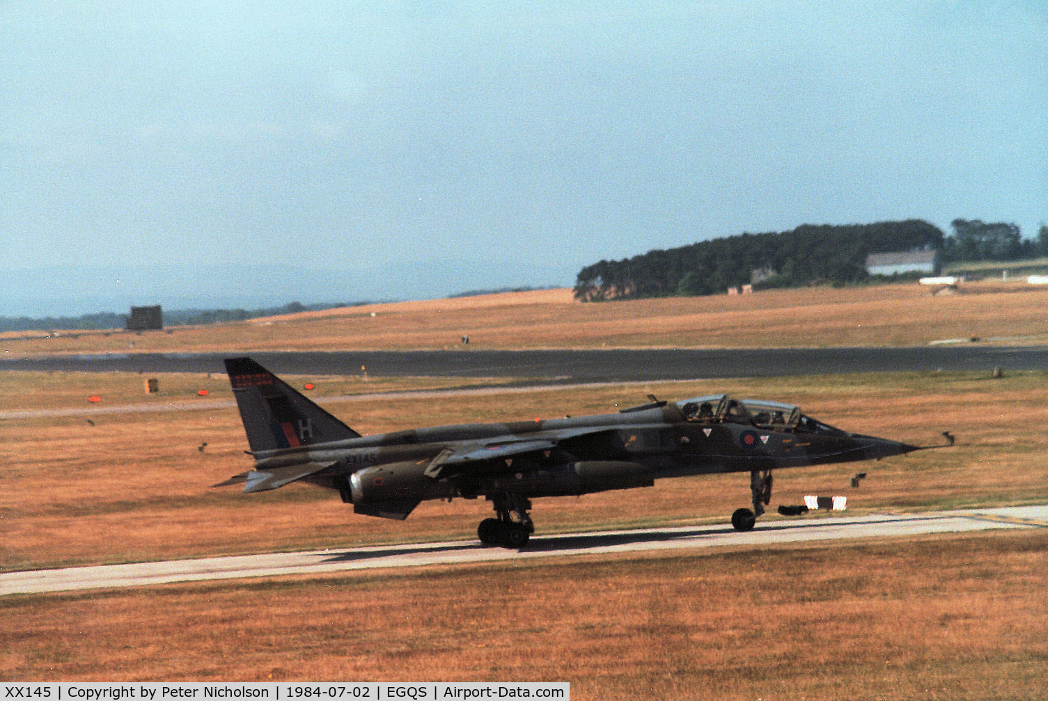 XX145, 1974 Sepecat Jaguar T.2 C/N B.10, Jaguar T.2 of 226 Operational Conversion Unit joining the active runway at RAF Lossiemouth in the Summer of 1984, ten years after first arriving there with the Unit