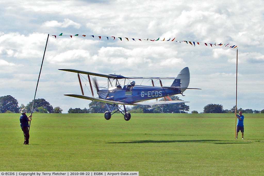 G-ECDS, 1943 De Havilland DH-82A Tiger Moth II C/N 86347, 1943 DE HAVILLAND AIRCRAFT CO LTD DH82A TIGER MOTH C/N 86347  attempts to 'limbo' the washing line of bunting at the 2010 Sywell Airshow