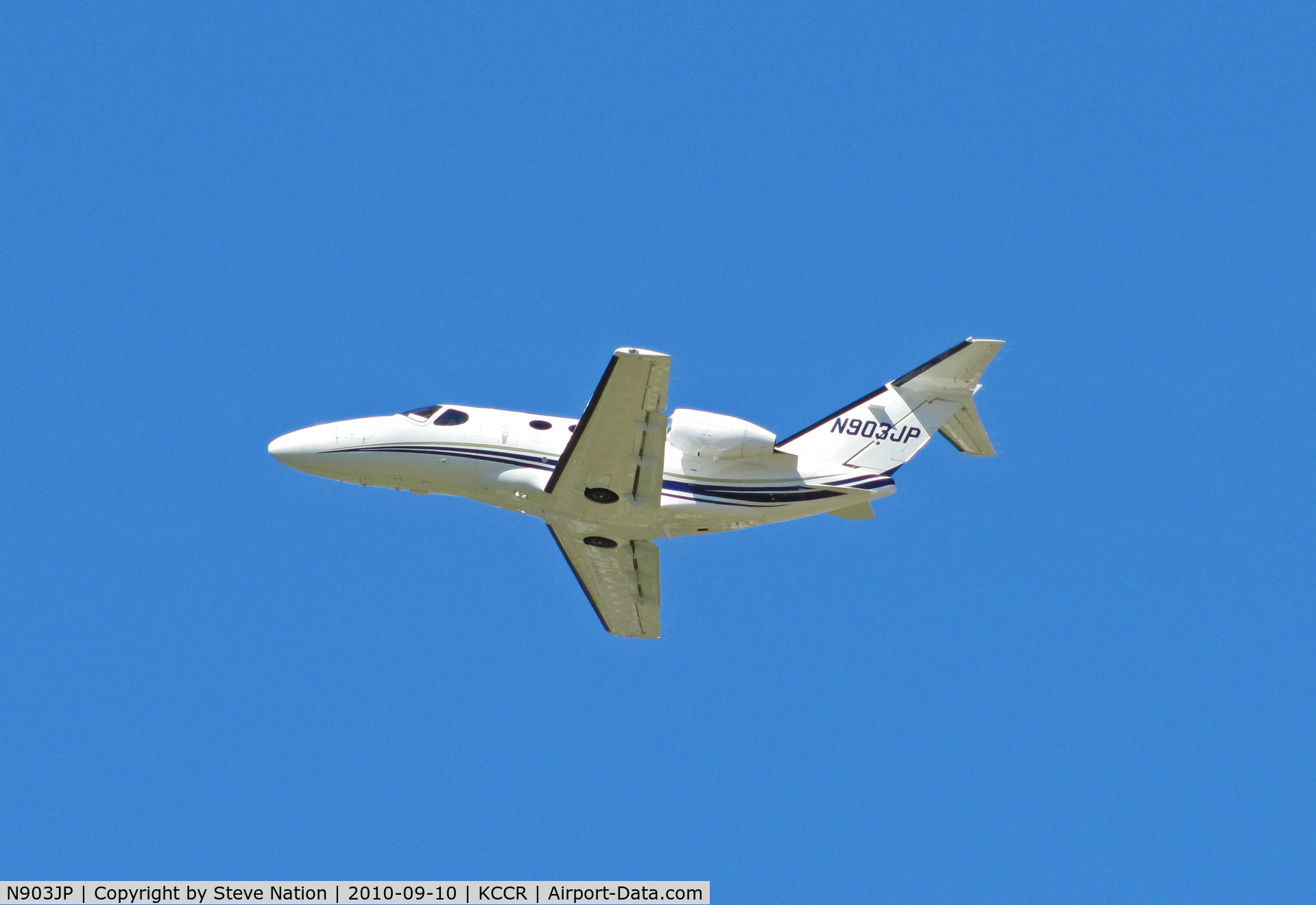 N903JP, 2008 Cessna 510 Citation Mustang C/N 510-0102, Promag Retail Services 2008 Cessna 510 climbs out from RWY19L from home base