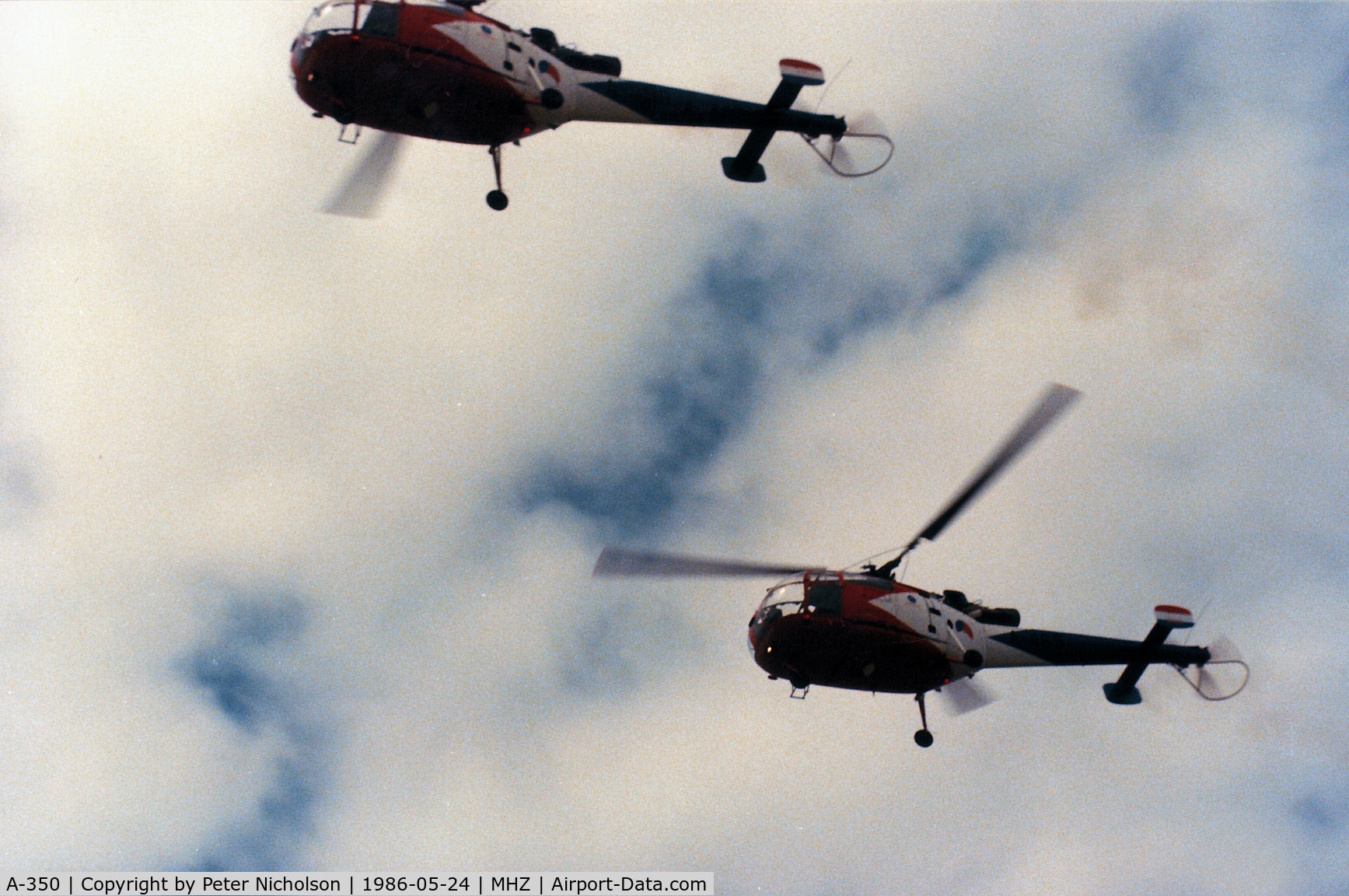 A-350, Sud SE-3160 Alouette III C/N 1350, Alouette III of the Royal Netherlands Air Force's Grasshoppers aerial display team in action at the 1986 RAF Mildenhall Air Fete.