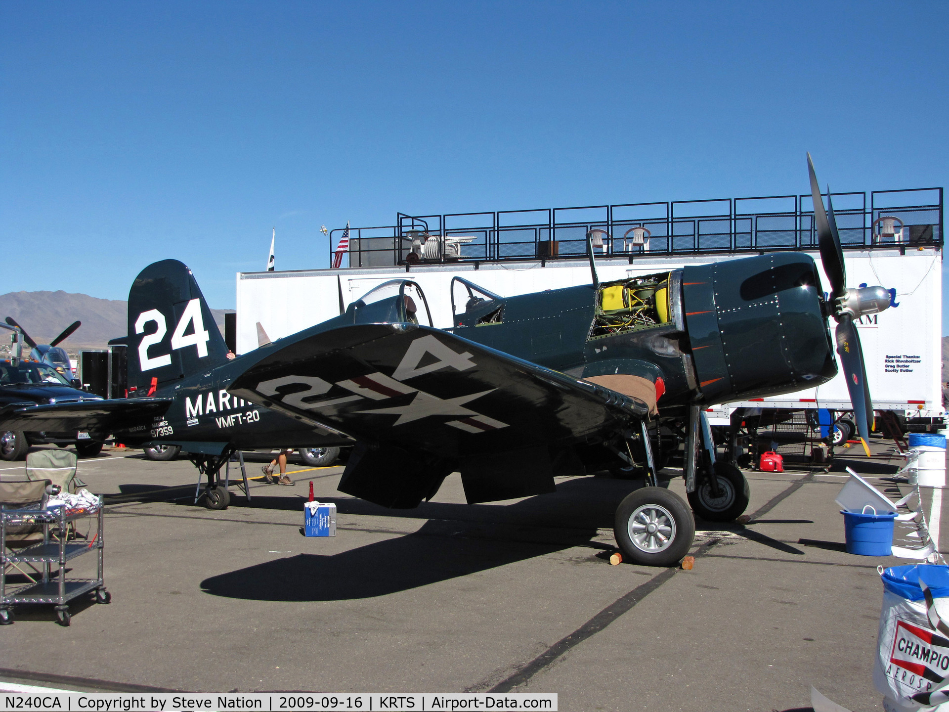 N240CA, 1945 Vought F4U-4 Corsair C/N 9513, Race #24 F4U-4 BuAer 97359 VMFT-20 Marines being worked on pits as NX240CA for Unlimited Class race @ 2009 Reno Air Races