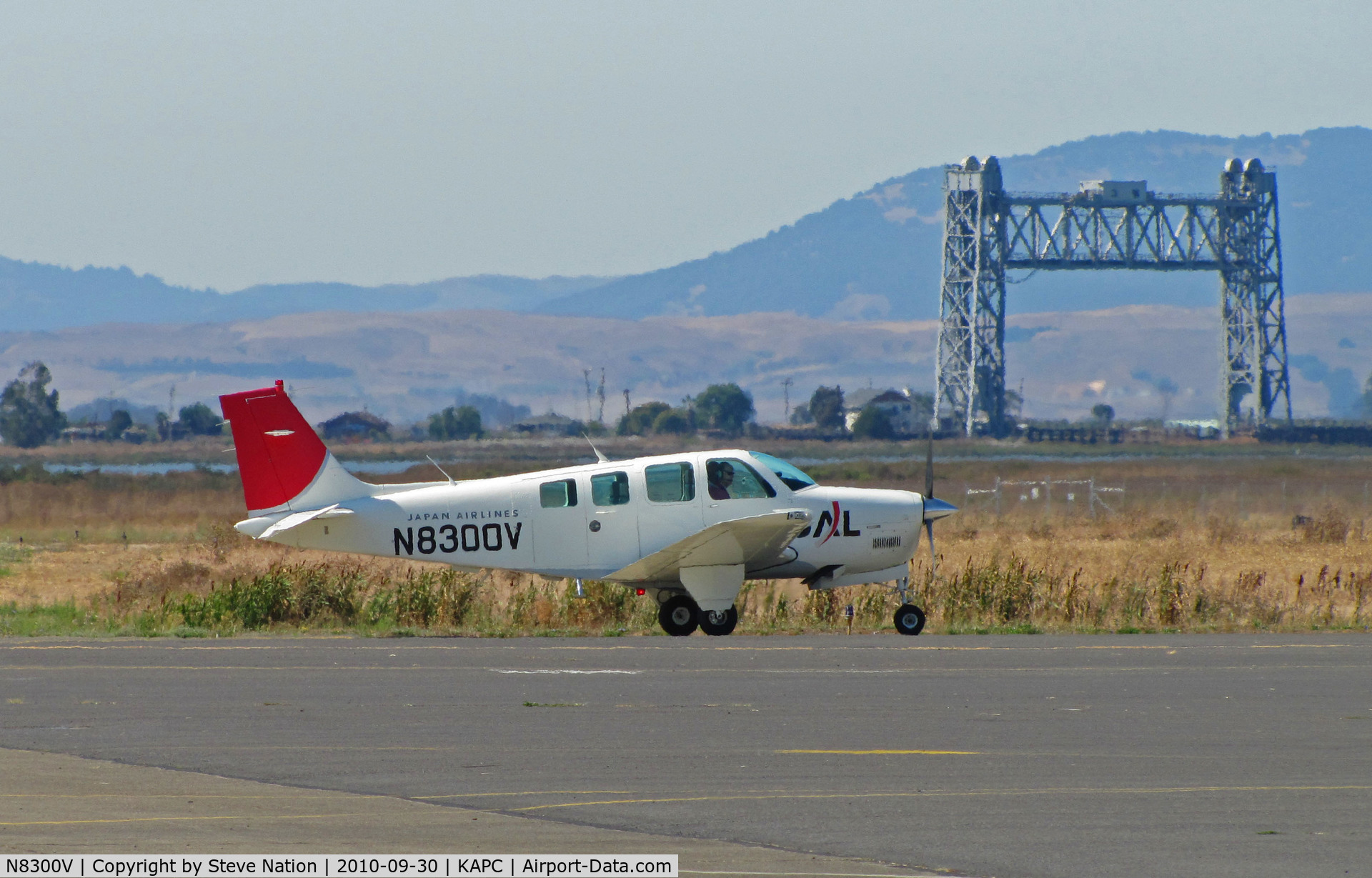 N8300V, 1992 Beech A36 Bonanza 36 C/N E-2767, Japan Airlines 1992 Beech A36 (now in new colors) taxiing by Napa River RR bridge