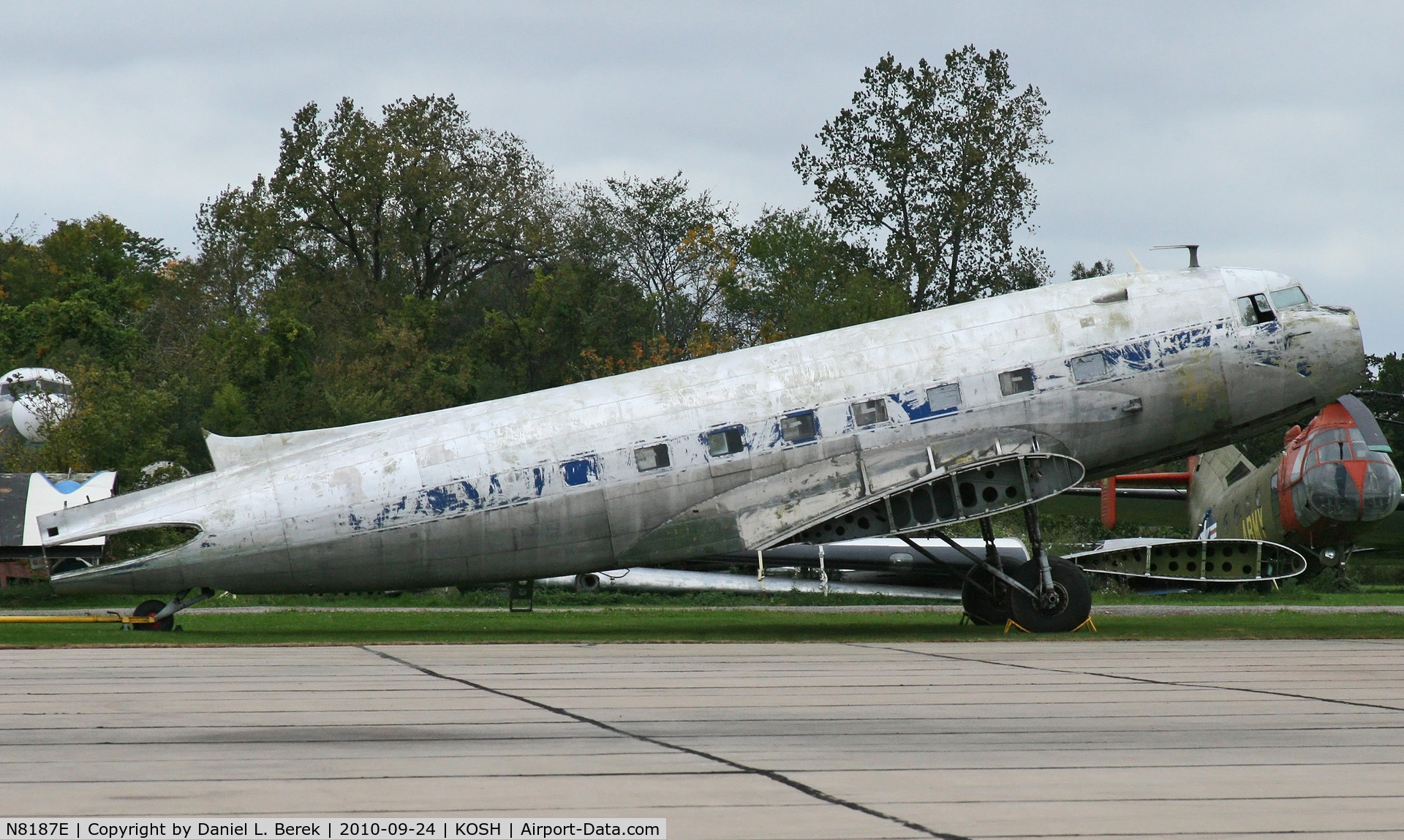 N8187E, Douglas DC-3C C/N 13840, Sitting on the Basler Turbo Avaition ramp at Oshkosh, WI, probably awaiting either conversion.  Formerly Miami Valley Airlines.