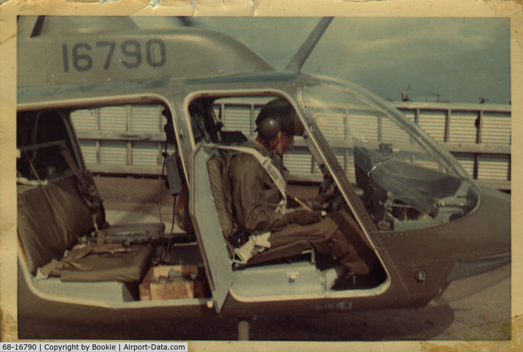 68-16790, 1968 Bell OH-58A-BF Kiowa C/N 40104, Taken in a revetment at  Sanford Army Airfield, Long Bien, Viet Nam. July of 1970.  I'm filling out the log book after concluding all the flights for the day.  Grenades & M-60 machine gun in the back.