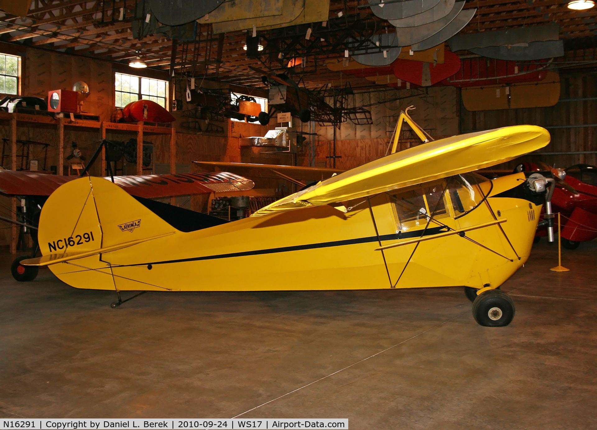 N16291, 1936 Aeronca C-3 C/N A-668, On display among other Golden Age aircraft in one of the several hangars bordering Pioneer Field.
