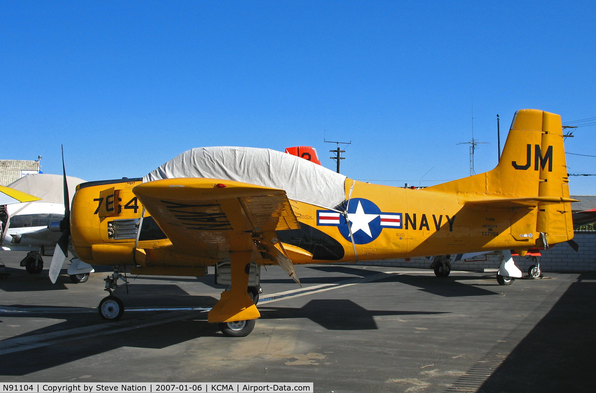 N91104, 1946 North American Navion C/N NAV-4-6, North American T-28B in NAVY yellow cs as JM/764 BuAer 137764 (painted as NX2207Y) at Camarillo Airport (CA) on sunny, balmy January day