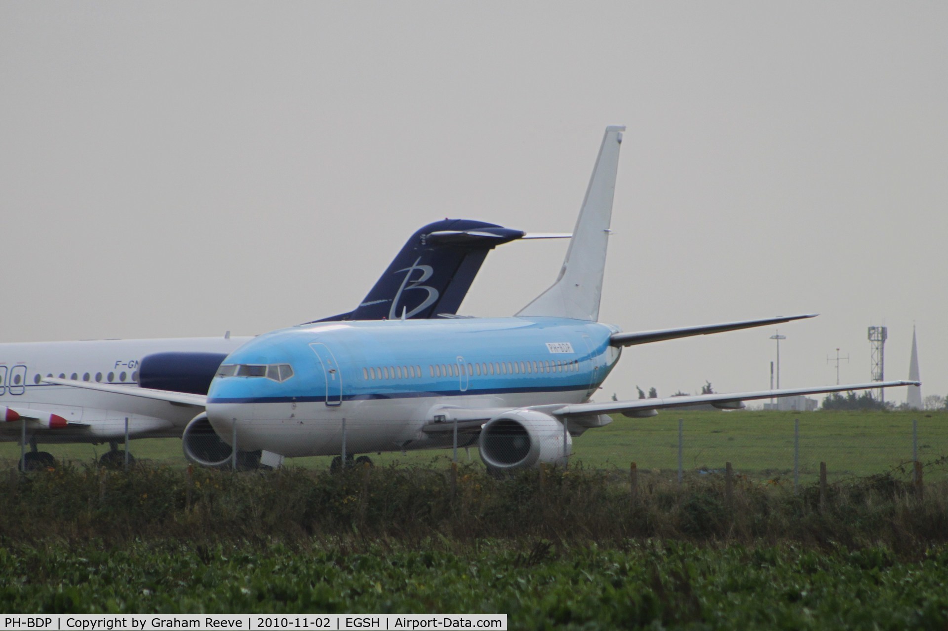PH-BDP, 1989 Boeing 737-306 C/N 24404, With logos removed but still in KLM colours. Fokker 100 in back ground.