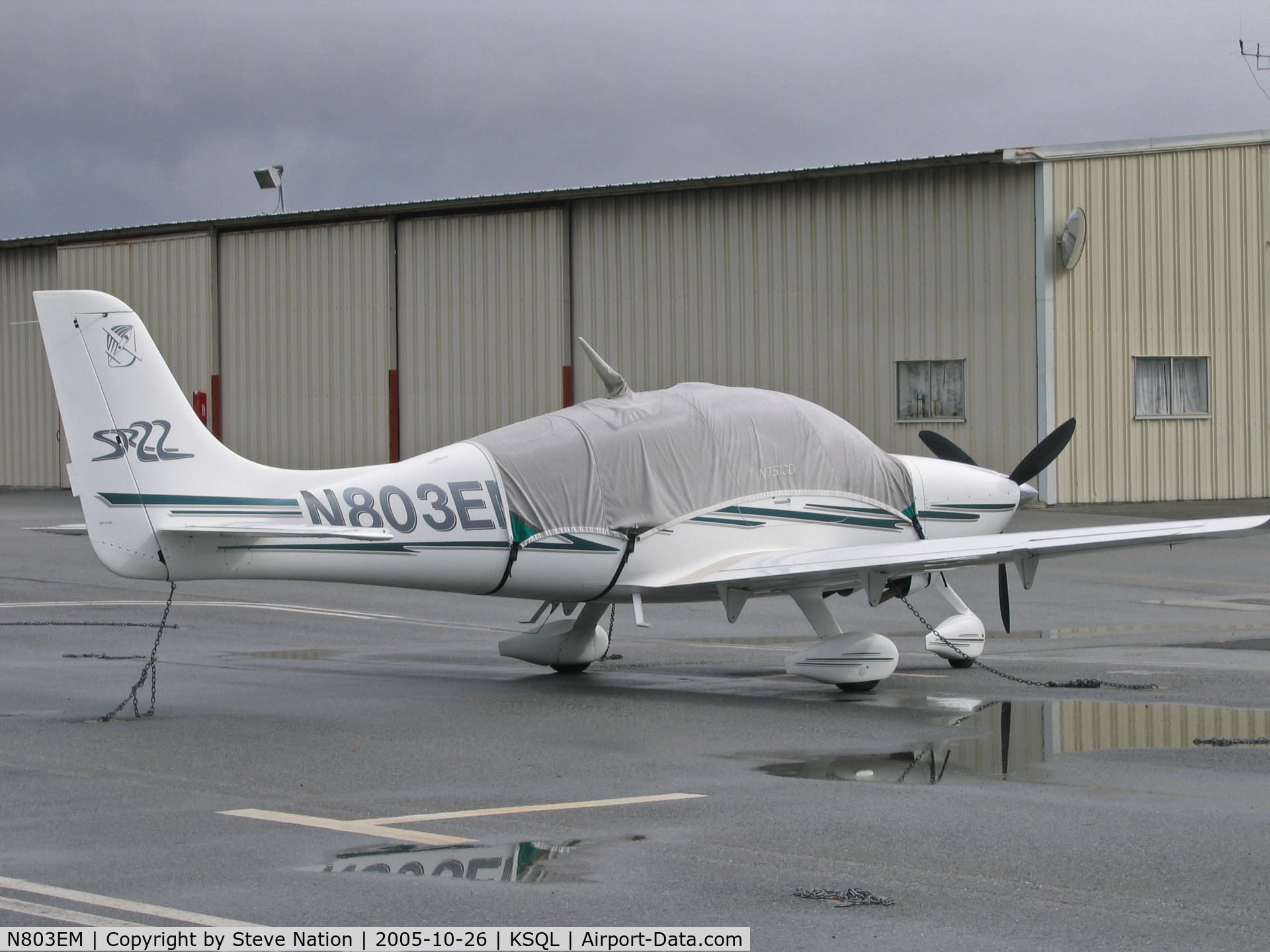 N803EM, 2003 Cirrus SR22 C/N 0457, 2003 Cirrus Design SR22 buttoned up for rain @ San Carlos, CA home base (sold to owner in Iowa in May 2007)