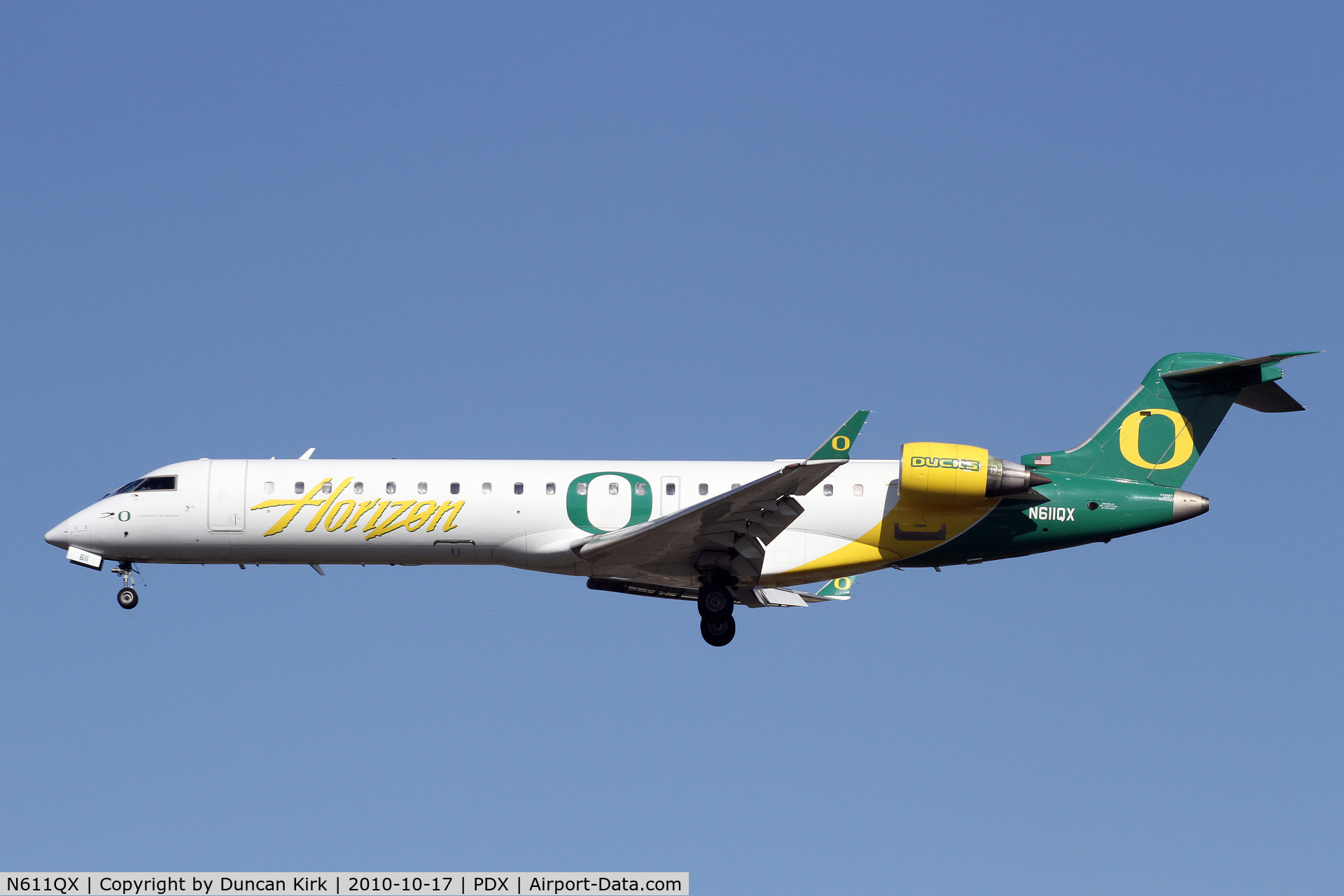 N611QX, Bombardier CRJ-701 (CL-600-2C10) Regional Jet C/N 10041, Flying the colors of the current #1 college football team in the country
