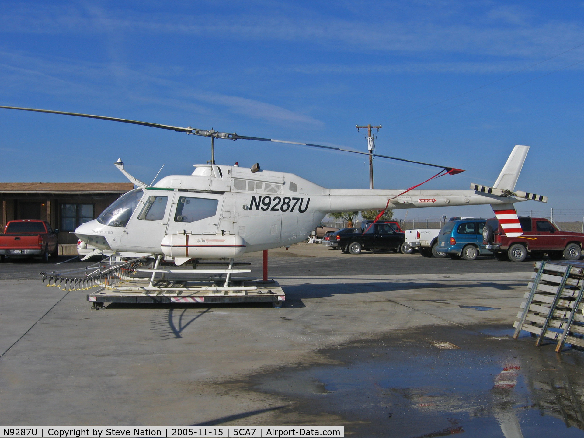 N9287U, 1971 Bell OH-58A C/N 71-20428, American West Aviation Bell OH-58A (ex 71-20428) in all white scheme rigged for spraying @ AWA airstrip NE of Five Points, CA