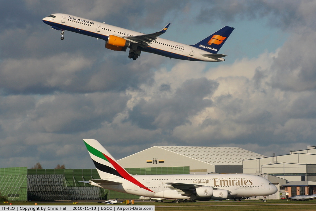 TF-FIO, 1999 Boeing 757-208 C/N 29436, Icelandair B757 departing from RW23R as Emirates A380 taxis to its stand