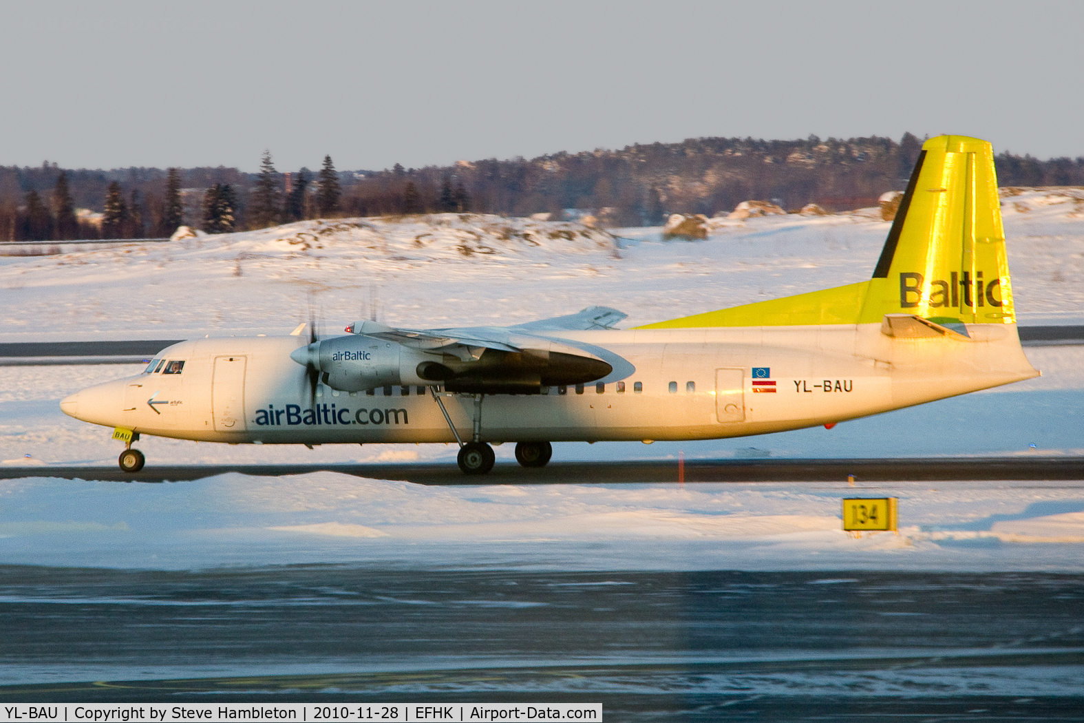 YL-BAU, 1988 Fokker 50 C/N 20126, Taken in the early morning light from inside Terminal 2