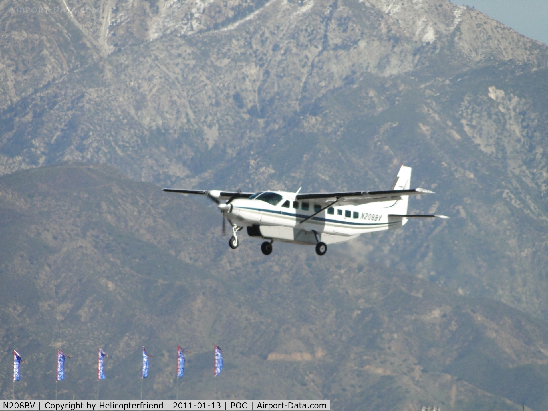 N208BV, 2001 Cessna 208B C/N 208B0913, Over runway 26R preparing to touchdown