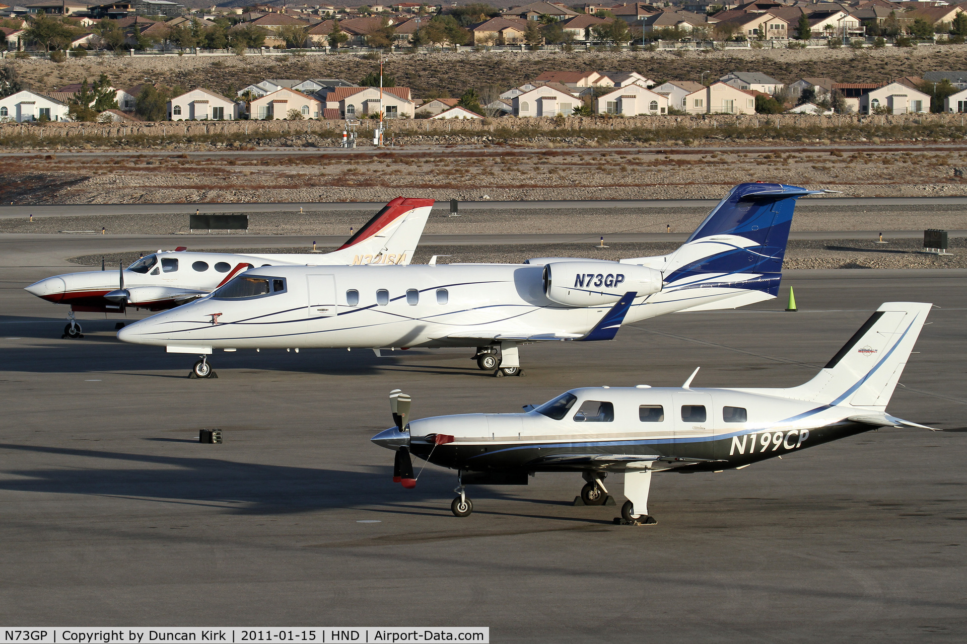 N73GP, 1986 Gates Learjet 55B C/N 55-127, N73GP shares the ramp with other corporate aircraft at Henderson, NV