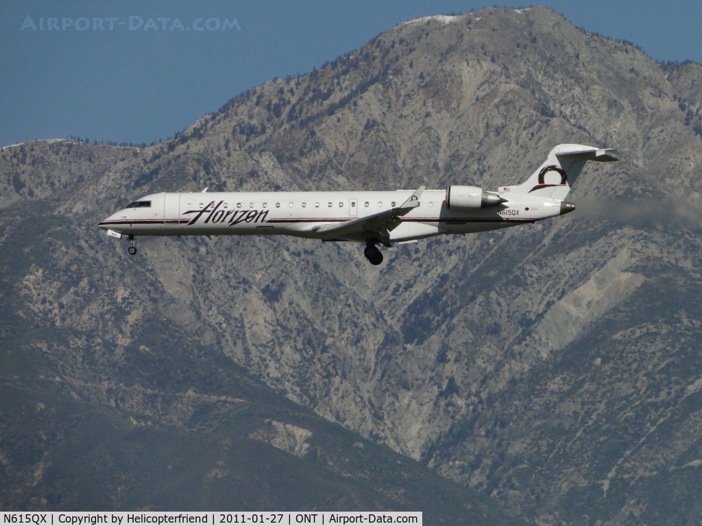N615QX, 2002 Bombardier CRJ-701 (CL-600-2C10) Regional Jet C/N 10065, On final to runway 26R