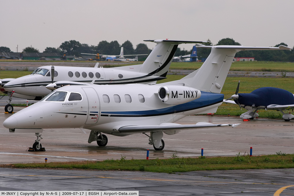 M-INXY, 2009 Embraer EMB-500 Phenom 100 C/N 50000024, Parked on the western apron
