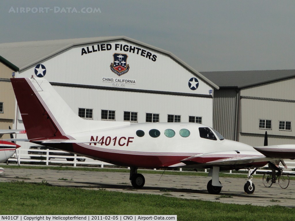 N401CF, 1967 Cessna 401 C/N 401-0115, Parked in the area north of runway 26R and west of the Tower
