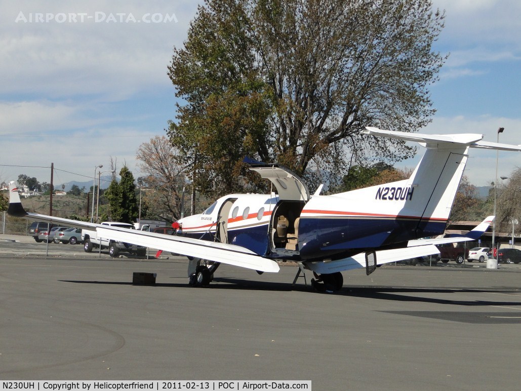 N230UH, 1998 Pilatus PC-12/45 C/N 230, Plane parked in transient parking and being wiped down