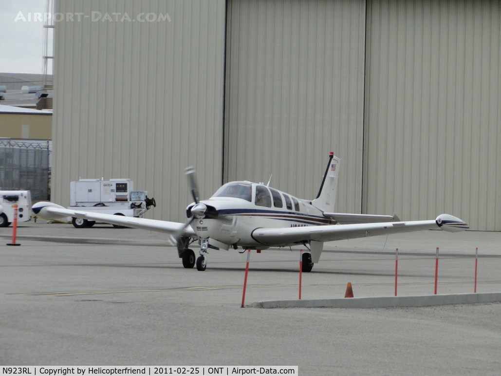 N923RL, Raytheon Aircraft Company A36 Bonanza C/N E3537, Taxiing out of the south parking area heading towards runway 26
