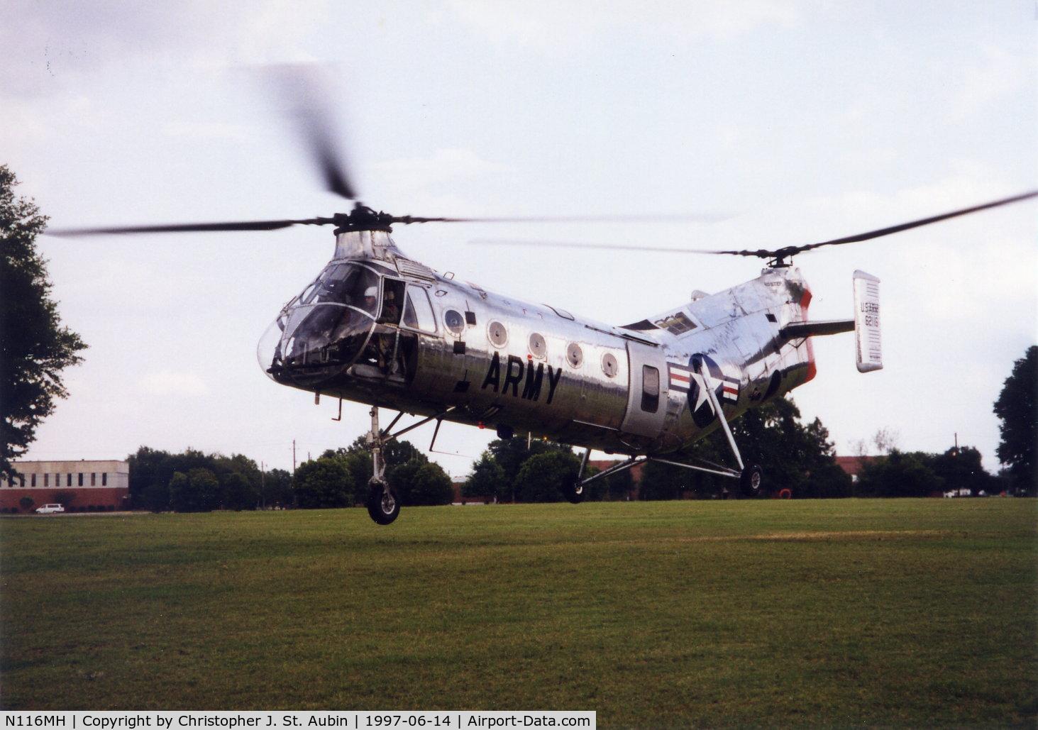 N116MH, 1956 Vertol CH-21C Shawnee C/N C.278, CH-21C 56-2116 N116MH hovers over the parade field at Rt. Rucker, AL.  Acft flown from Springdale, AR to Ft. Rucker for 1997 Army Warrant Officer Convention.