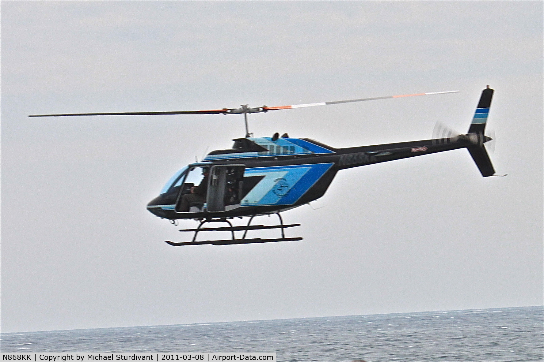 N868KK, 1976 Bell 206B JetRanger C/N 2031, This helicopter circled my area for 15 minutes today.  I went down to the beach to see what was going on and found it hovering at the waters edge and below the height of the dunes.  It the flew East along the coast.