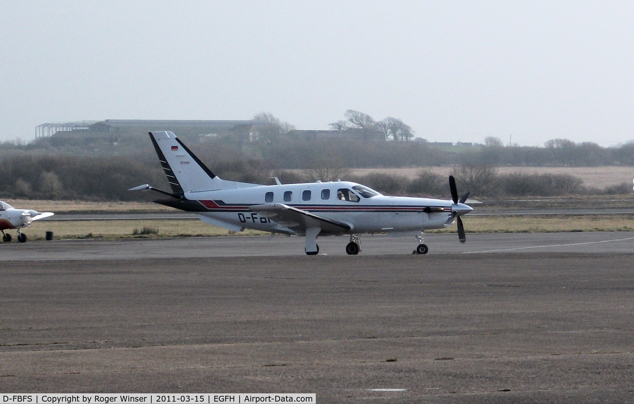 D-FBFS, 2006 Socata TBM-850 C/N 387, Visiting Swansea Airport on a misty day.