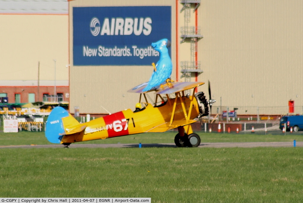 G-CGPY, 1945 Boeing E75N1 C/N 75-5303, promoting the new animated film 'Rio' taking 'Blu' wingwalking