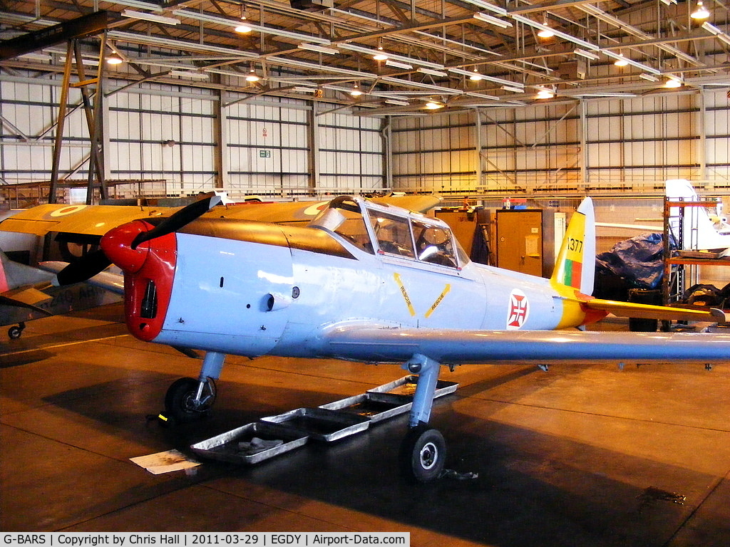 G-BARS, 1952 De Havilland DHC-1 Chipmunk T.10 C/N C1/0557, inside the 727 NAS Hangar. In Portugese Air Force colours and wearing the serial 1377