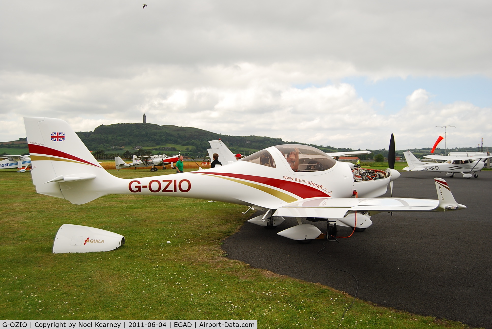 G-OZIO, 2009 Aquila A210 (AT01) C/N AT01-199, Parked on the apron at Newtownards Airfield.