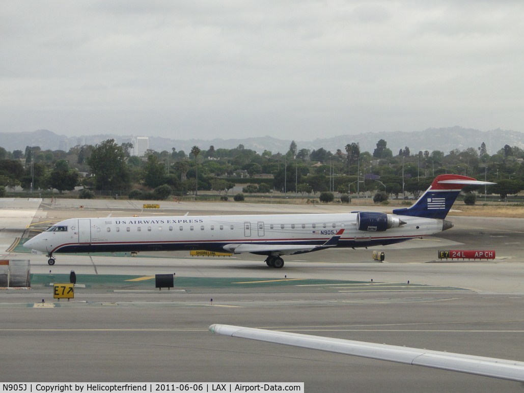 N905J, 2003 Bombardier CRJ-900 (CL-600-2D24) C/N 15005, Waiting to taxi onto runway 24L