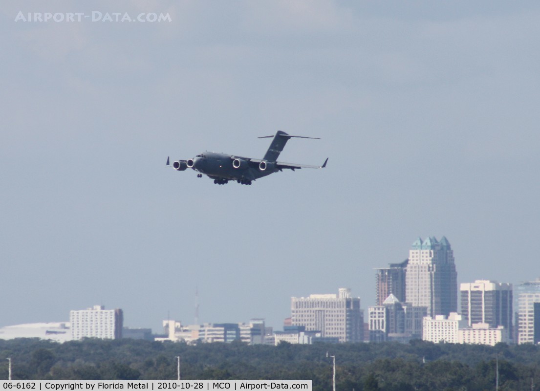 06-6162, 2006 Boeing C-17A Globemaster III C/N P-162, C-17 on approach into MCO with downtown Orlando in background