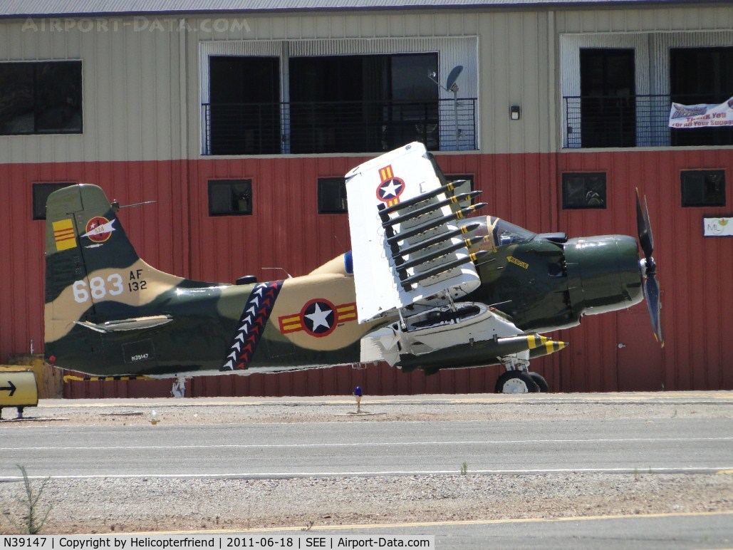 N39147, Douglas AD-5 (A-1E) Skyraider C/N 9540, Parked on the south side of runway 35/17, with wings folded up