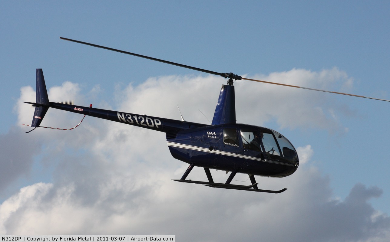 N312DP, 2003 Robinson R44 II C/N 10057, R44 leaving Heliexpo Orlando