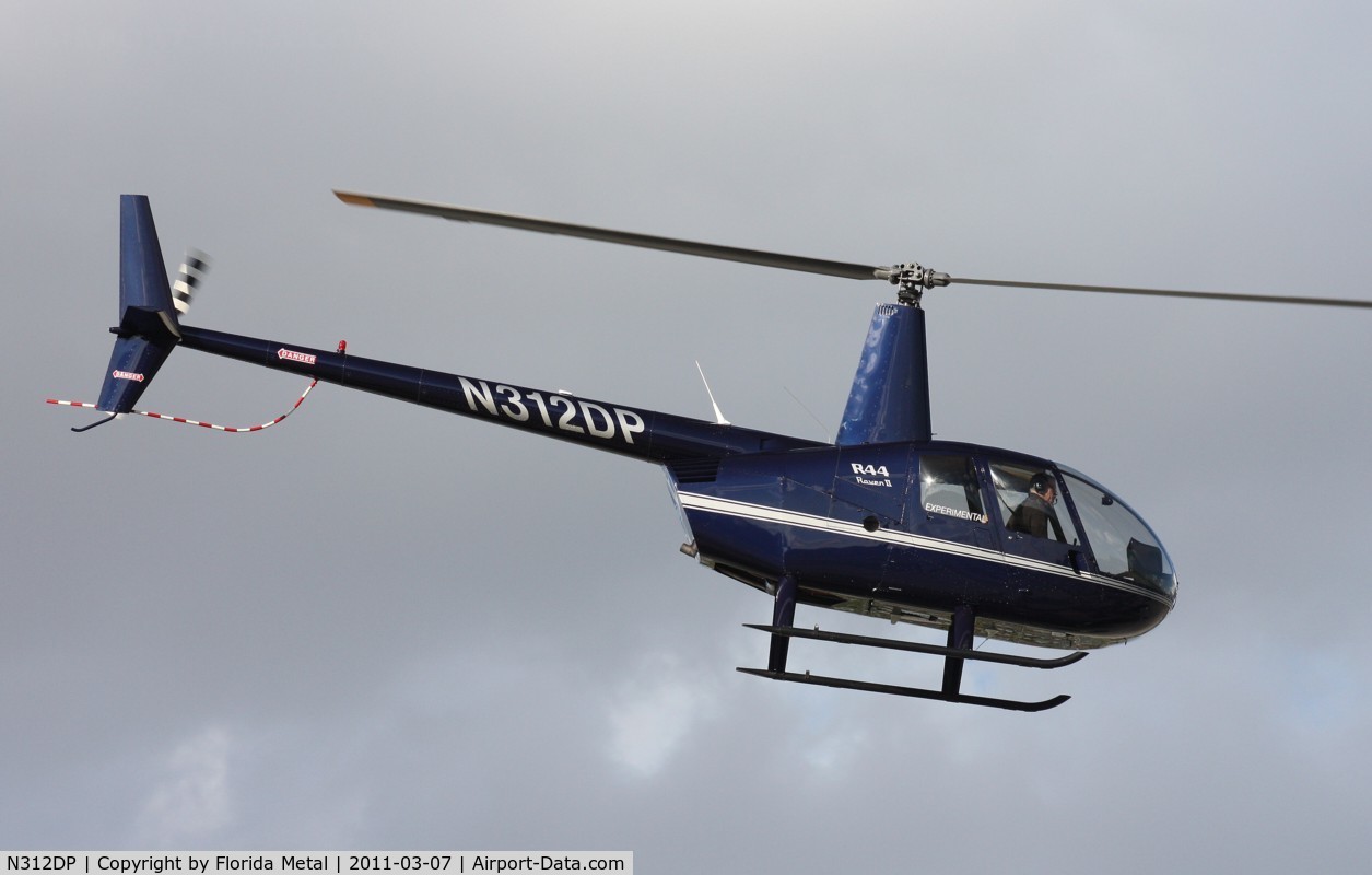 N312DP, 2003 Robinson R44 II C/N 10057, R44 leaving Heliexpo Orlando