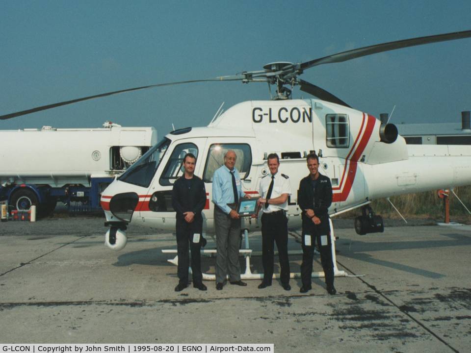 G-LCON, 1994 Eurocopter AS-355N Ecureuil 2 C/N 5572, August 1995: Photograph taken at BaE Warton, Preston, Lancashire, England. This was a presentation ceremony to  former Police Sergeant Jack Smith (Lancashire Constabulary) , the UKs first regular police air patrol officer.