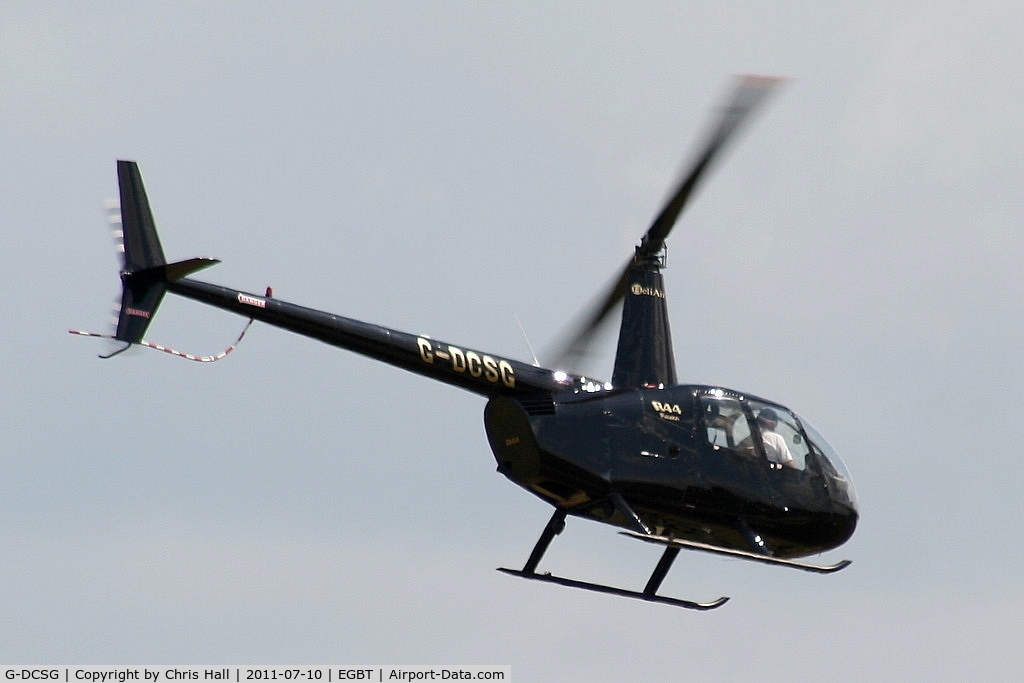 G-DCSG, 2000 Robinson R44 Raven C/N 0960, being used for ferrying race fans to the British F1 Grand Prix at Silverstone
