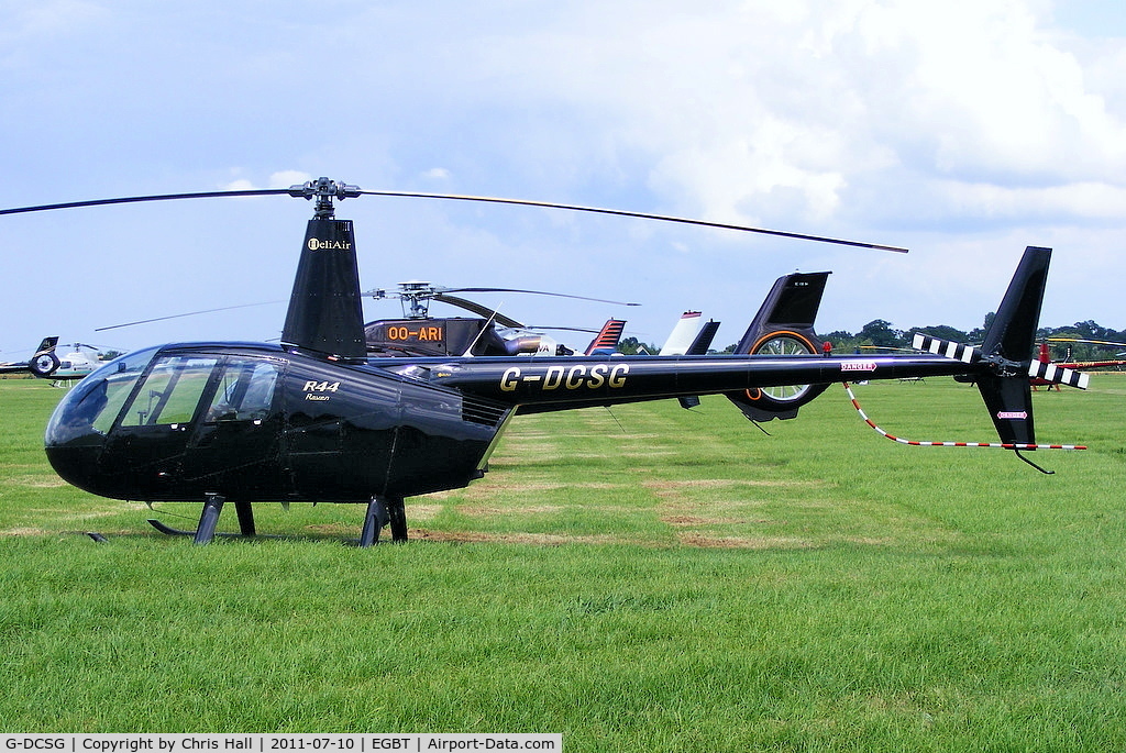 G-DCSG, 2000 Robinson R44 Raven C/N 0960, being used for ferrying race fans to the British F1 Grand Prix at Silverstone