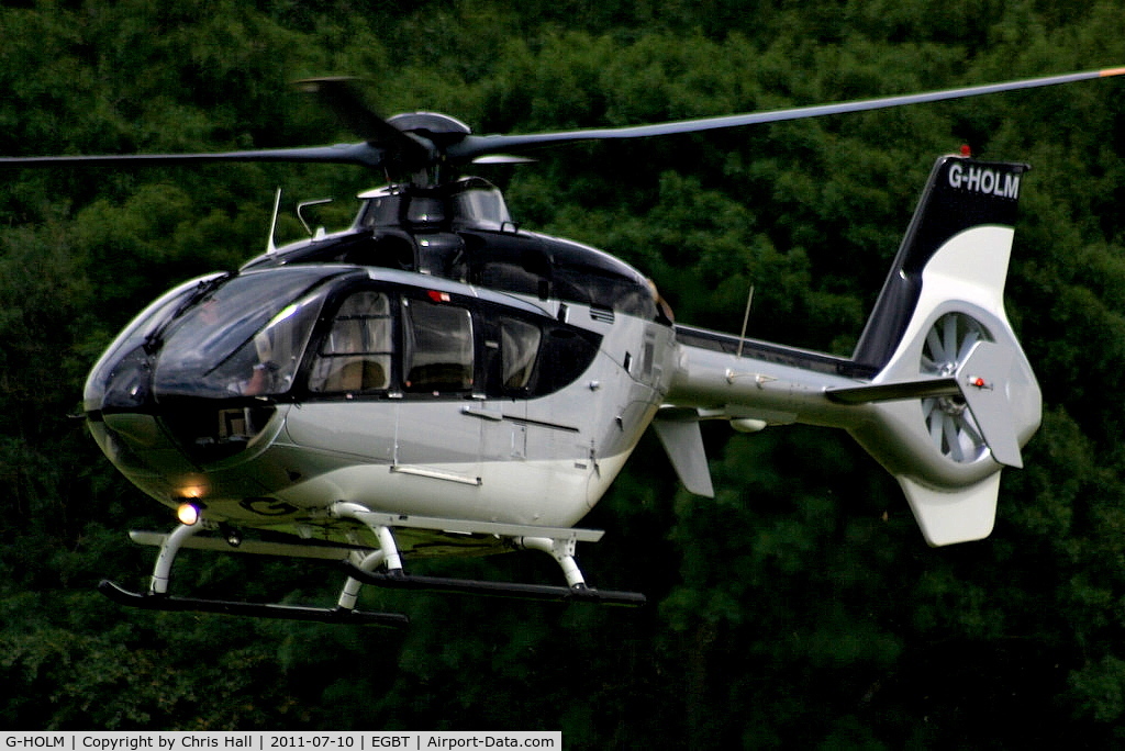 G-HOLM, 2007 Eurocopter EC-135T-2+ C/N 0574, being used for ferrying race fans to the British F1 Grand Prix at Silverstone