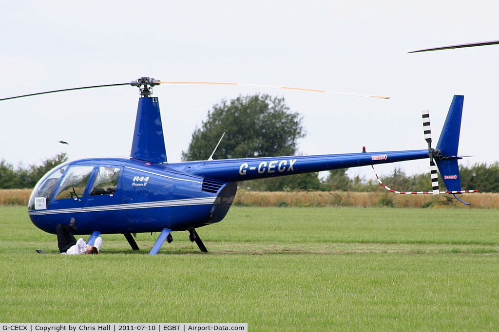 G-CECX, 2006 Robinson R44 Raven II C/N 11390, being used for ferrying race fans to the British F1 Grand Prix at Silverstone