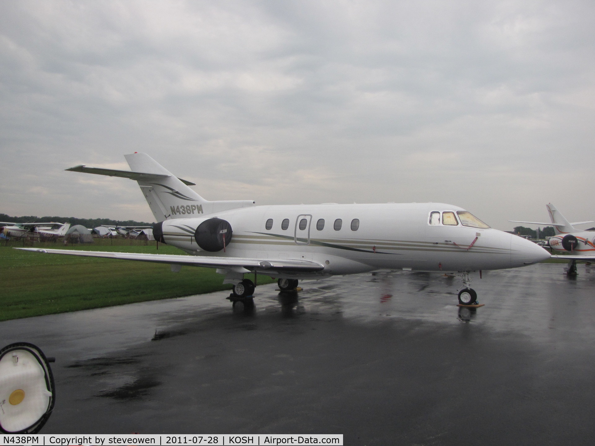 N438PM, 2003 Raytheon Hawker 800XP C/N 258636, on a grey wet day during EAA 2011