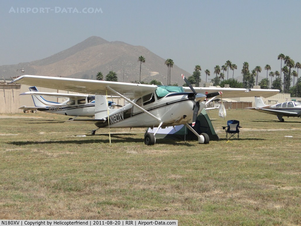 N180XV, 1961 Cessna 180D C/N 18050998, Appears to be camped out while parked in the grass