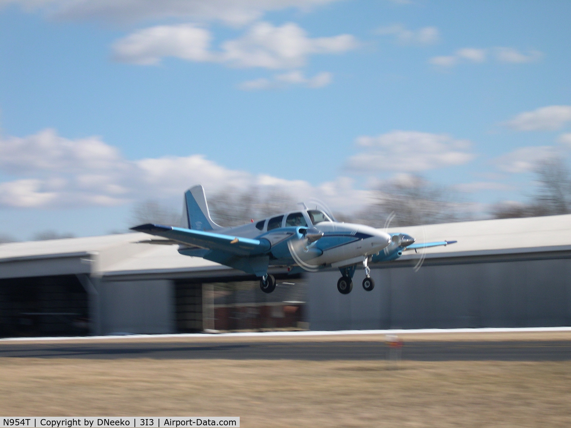 N954T, 1960 Beech B95 Travel Air C/N TD-393, Travel Air over the threshold rwy 26.  Formerly N954T, but now known as N210SK