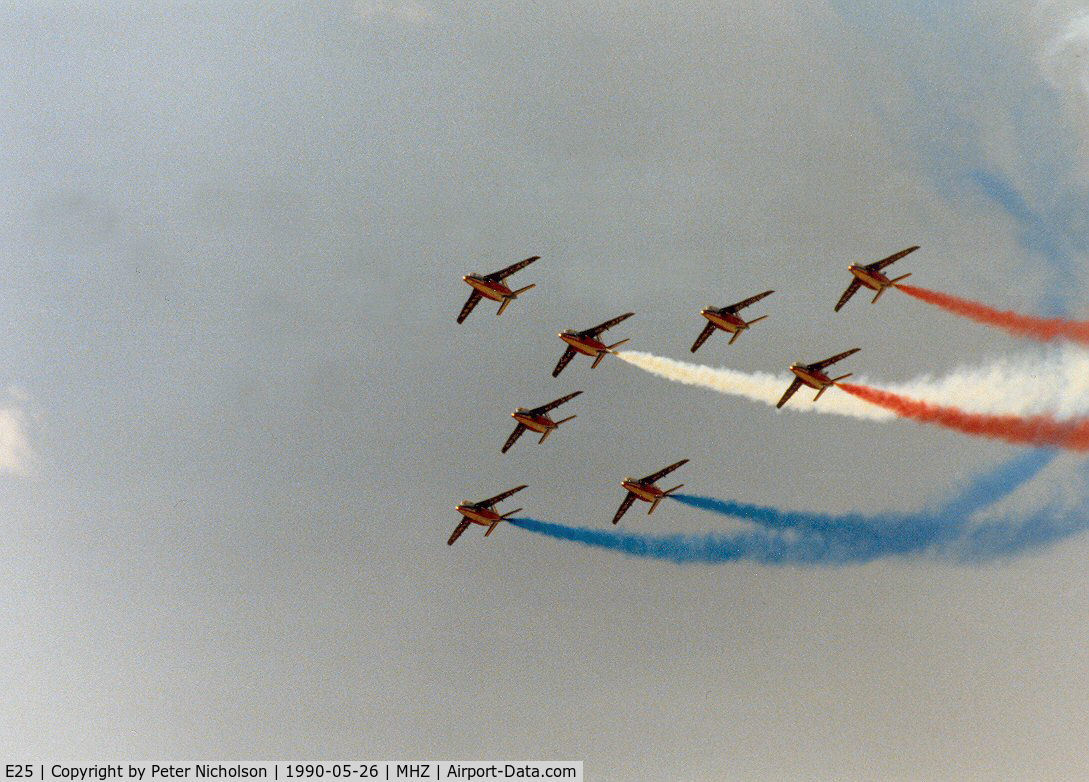 E25, Dassault-Dornier Alpha Jet E C/N E25, Alpha Jet number 1 of the Patrouille de France aerobatic display team leading the team in their display at the 1990 RAF Mildenhall Air Fete.