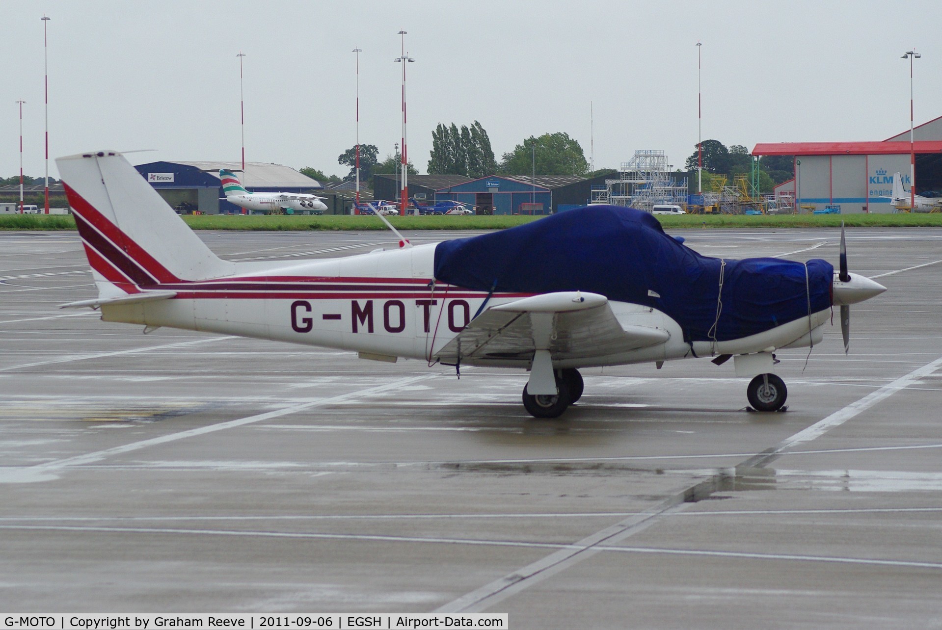 G-MOTO, 1962 Piper PA-24-180 Comanche Comanche C/N 24-3239, Parked on a wet and windy morning.