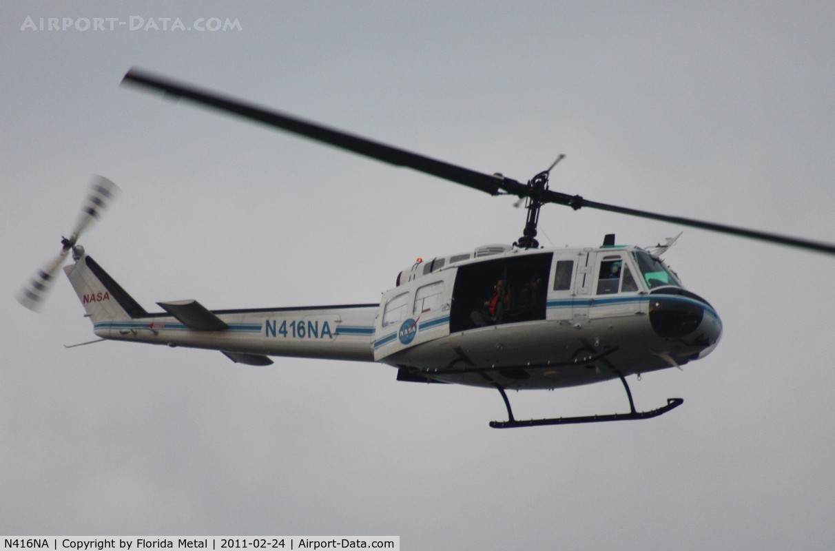 N416NA, Bell UH-1B C/N 622064, NASA UH-1B flying over Indian River at Titusville
