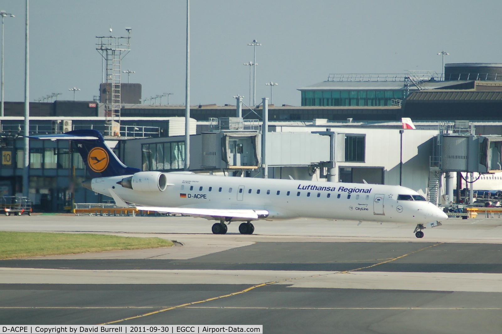 D-ACPE, 2001 Bombardier CRJ-701ER (CL-600-2C10) Regional Jet C/N 10027, Lufthansa Regional Canadair RJ700 Taxiing at Manchester Airport.